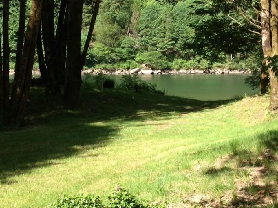 A short walk through trees brings you to the river front and access to the dock