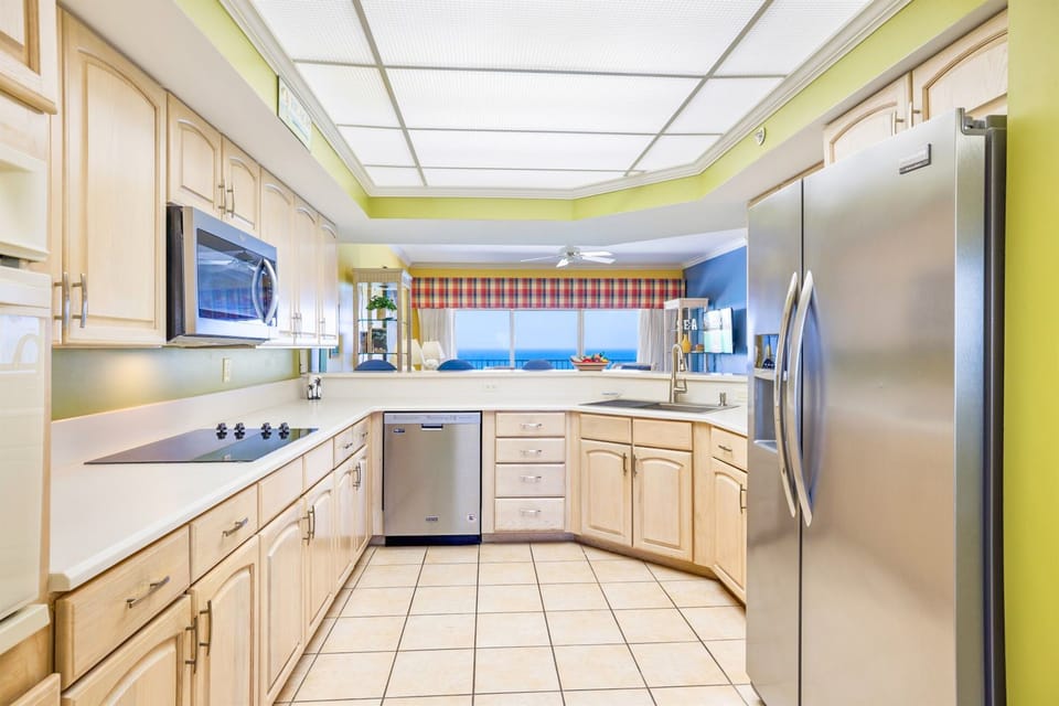 Largest kitchen in any condo!  Lots of cabinets, great appliances and all the flatware, cookware and bakeware to cook whatever you like!
