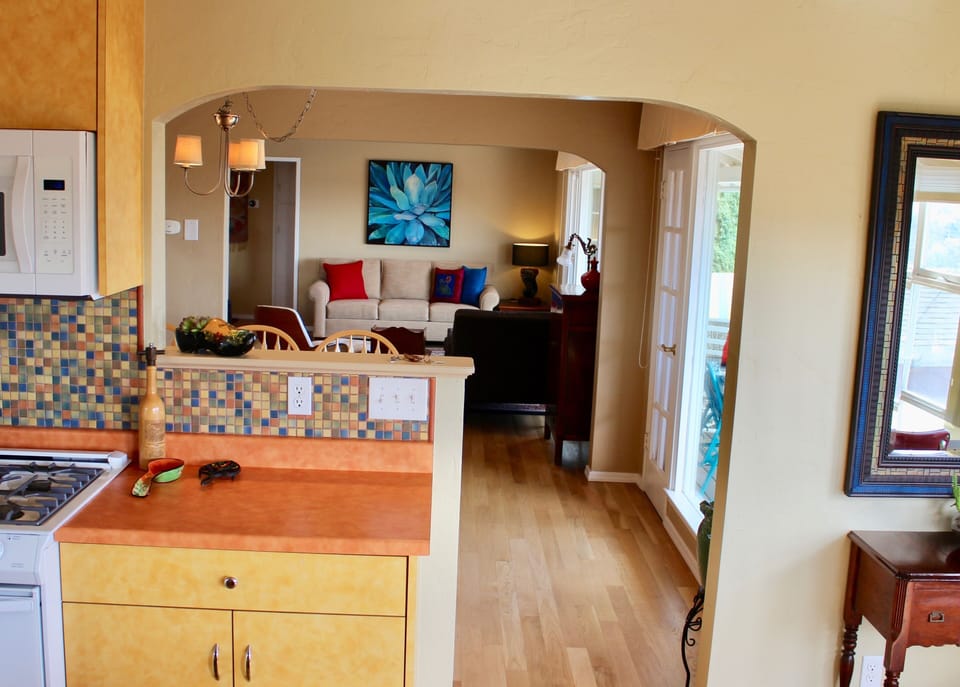 wonderful 1940's arches  from kitchen to dining to living room
