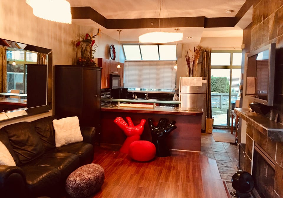 Living room open concept kitchen and onto back patio courtyard