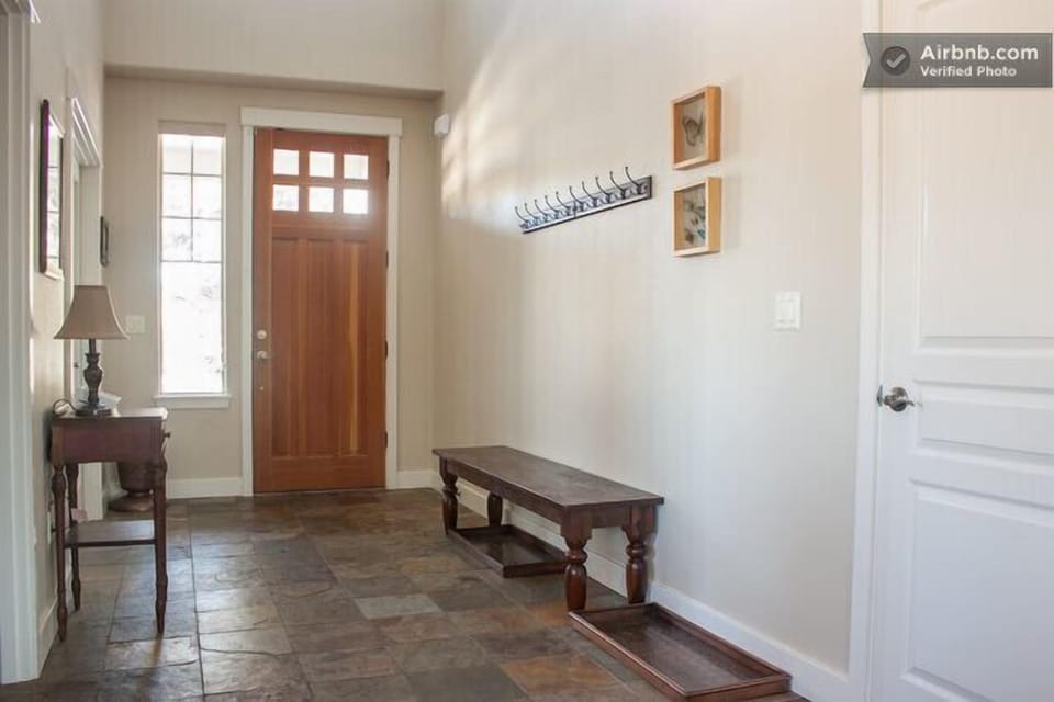 Slate entryway and a comfortable seat to take your shoes off