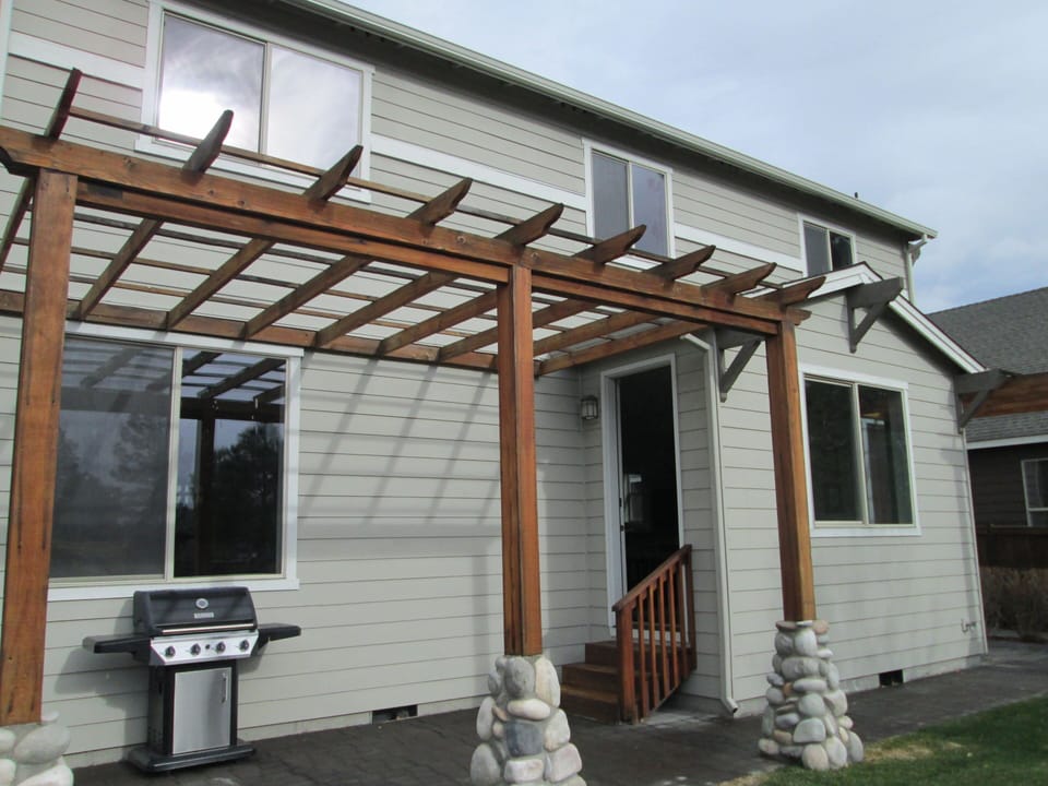 Gas grill with patio dining set for outdoor entertaining