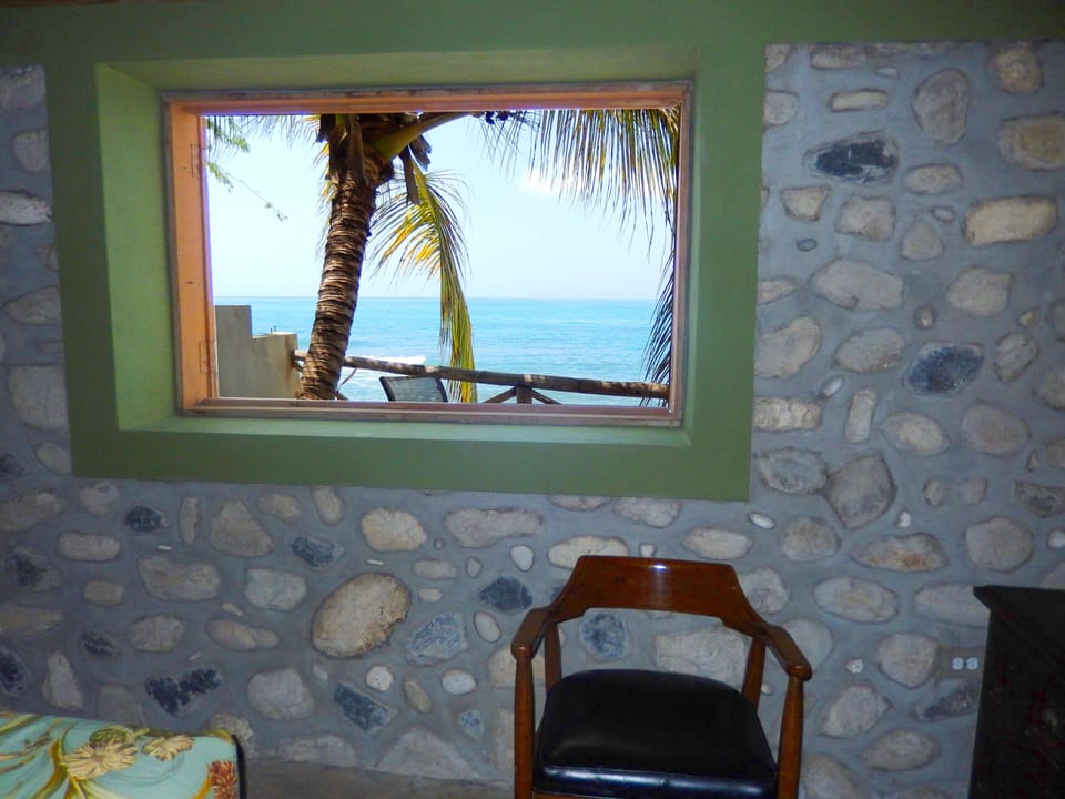 Large window offers amazing ocean view and sunsets.