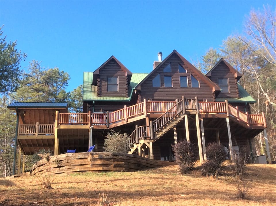 Large wrap around deck and fire pit area overlooking 500 acres of wilderness