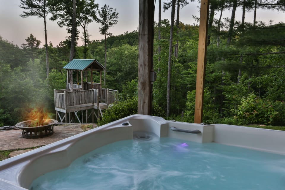 Soak and relax in the hot tub while enjoying the fire pit and nature around you.