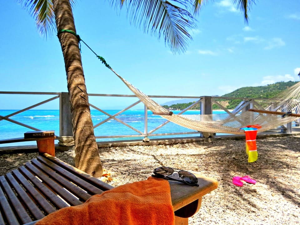 Lounge chairs and hammocks outside our room