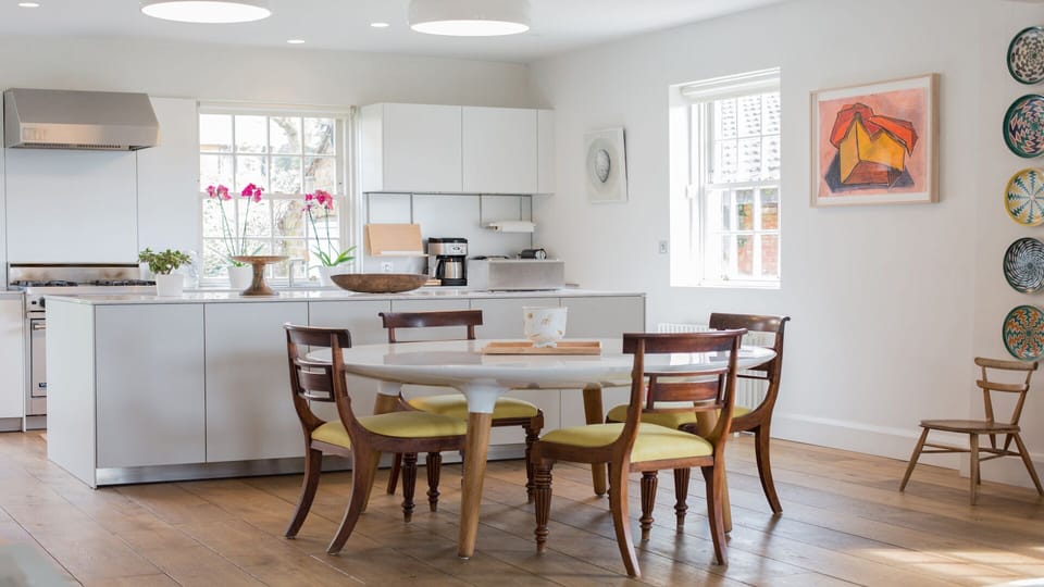 Modern white resin dining table with seating for six 