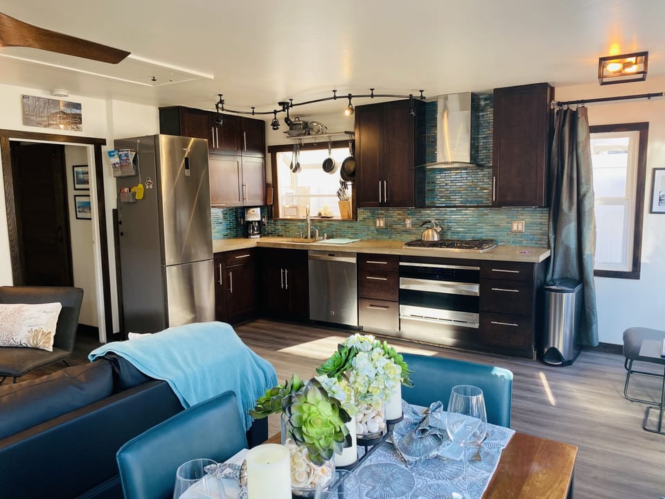Remodeled custom kitchen with concrete counters & stainless appliances 