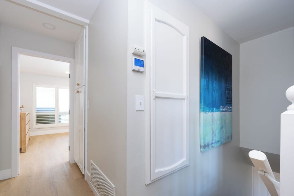 Hallway to stairs and Central Heating panel