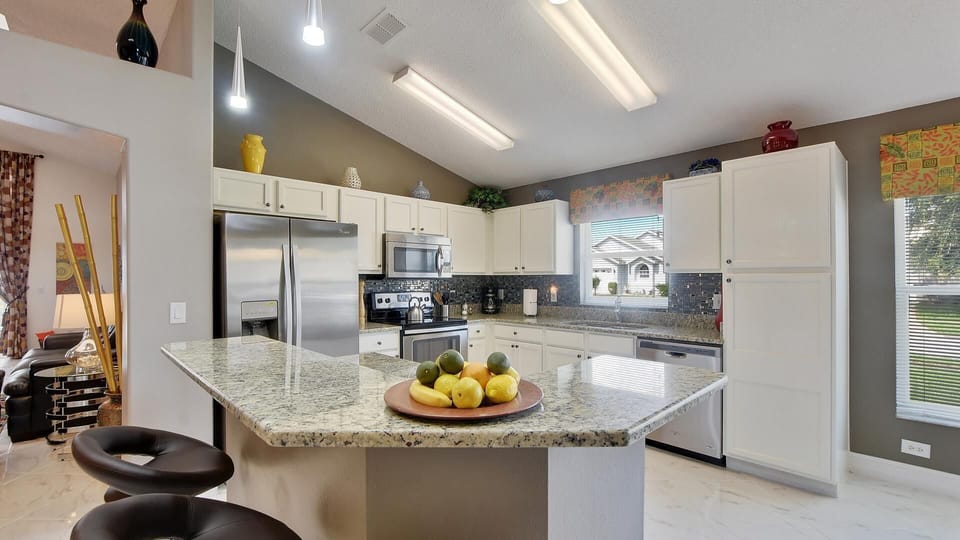 Brand new kitchen with stainless steel appliances and granit counter top
