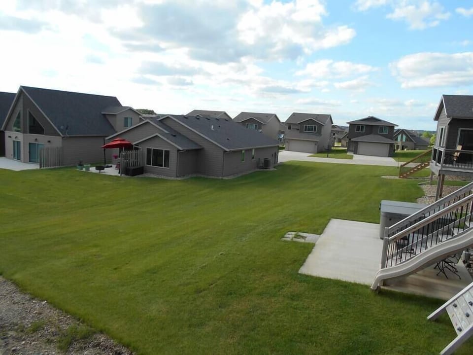 Cabin deck and patio opens onto large center greenspace.