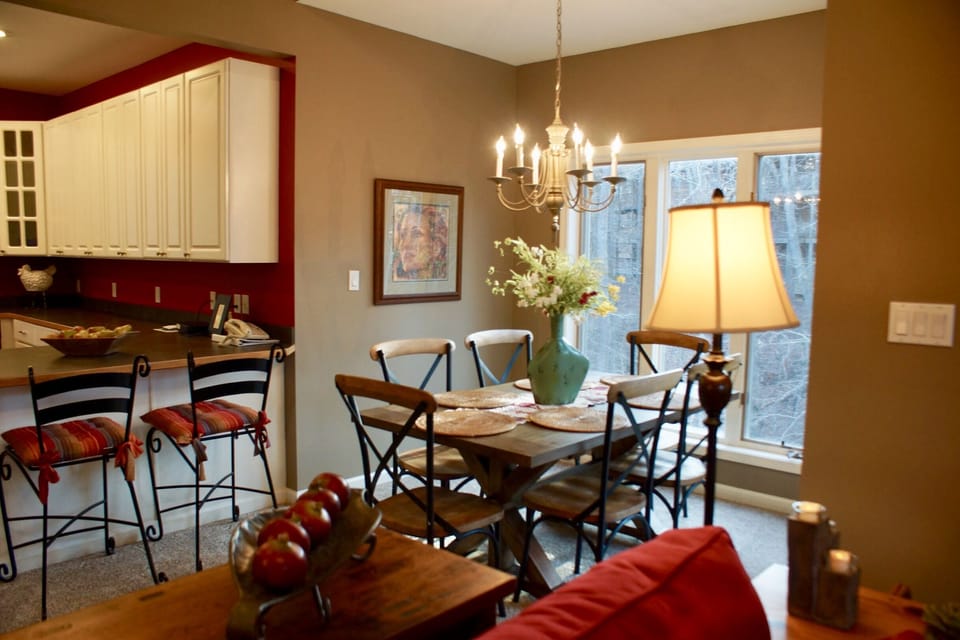 Dining table seats six plus two at bar