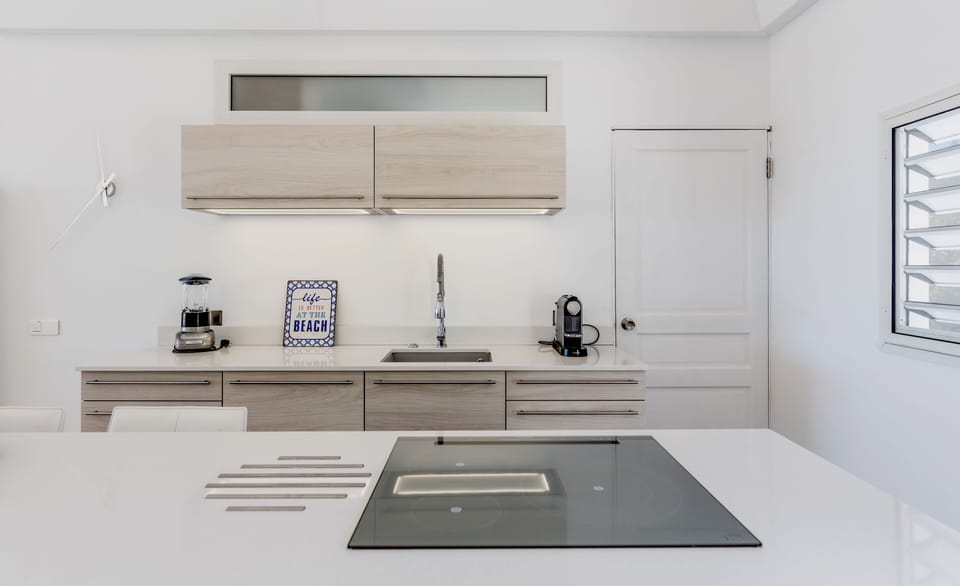 KITCHEN .
LAUDRY AT THE BACK