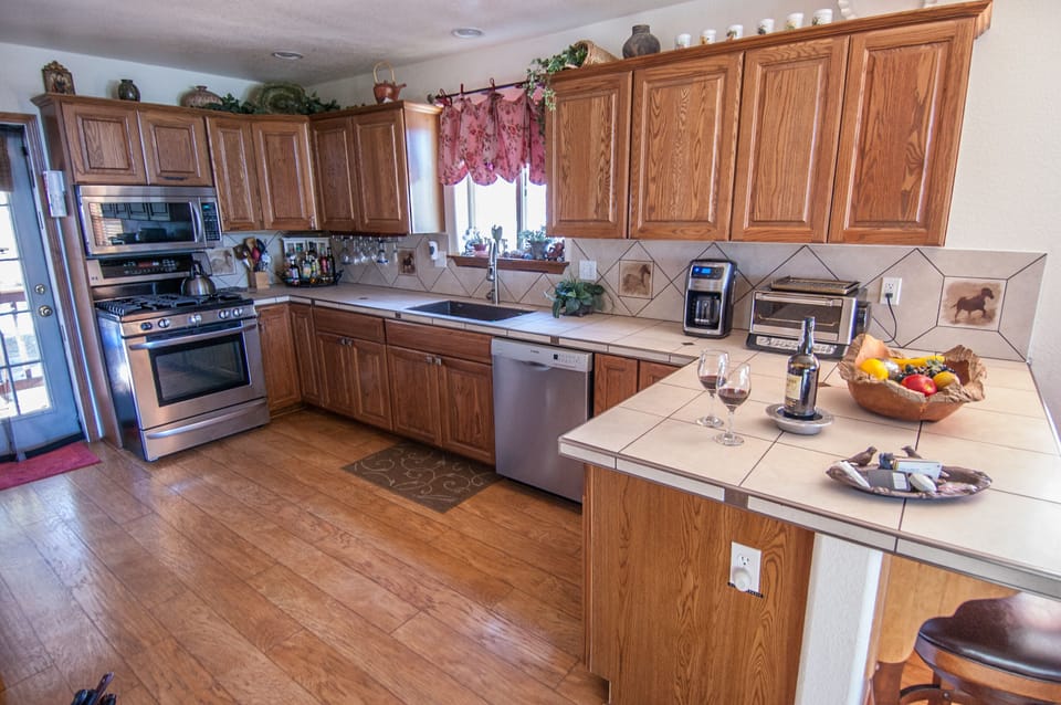 2nd covered deck w/ gas BBQ off kitchen; new appliances: gas range, dishwasher