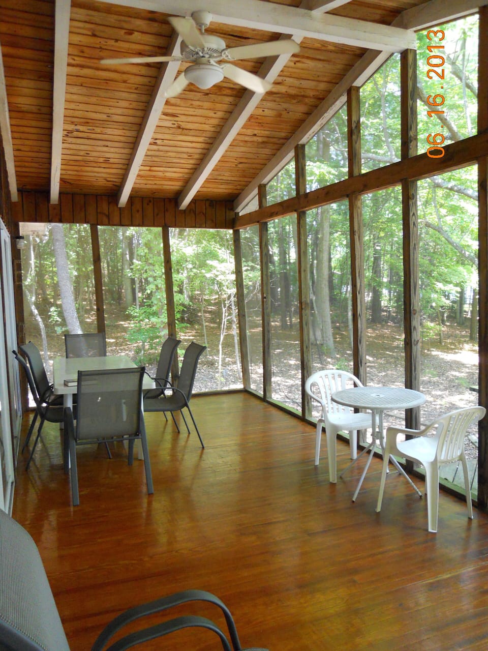 Large screen porch with view of the woods and cove