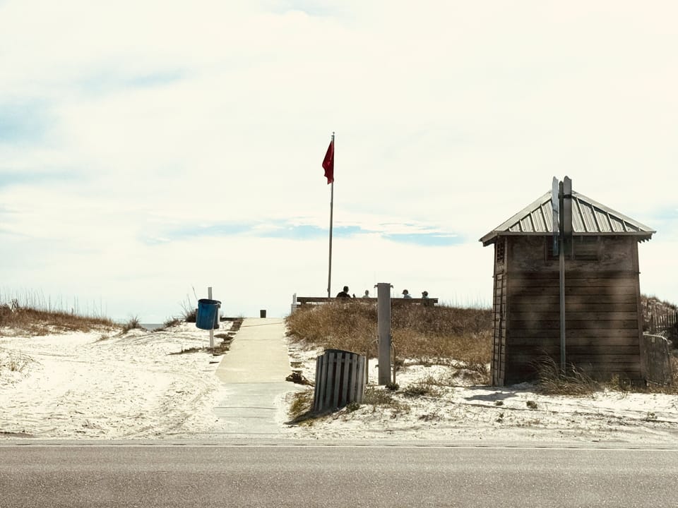 Public beach access w/ restroom on street.