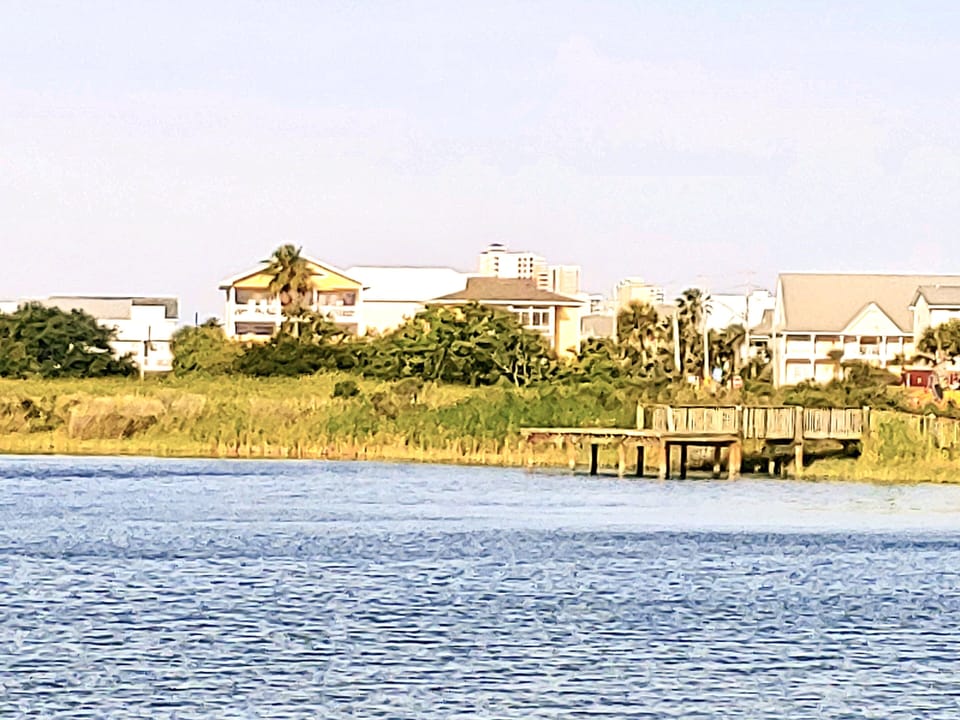 View of house with public fishing pier.