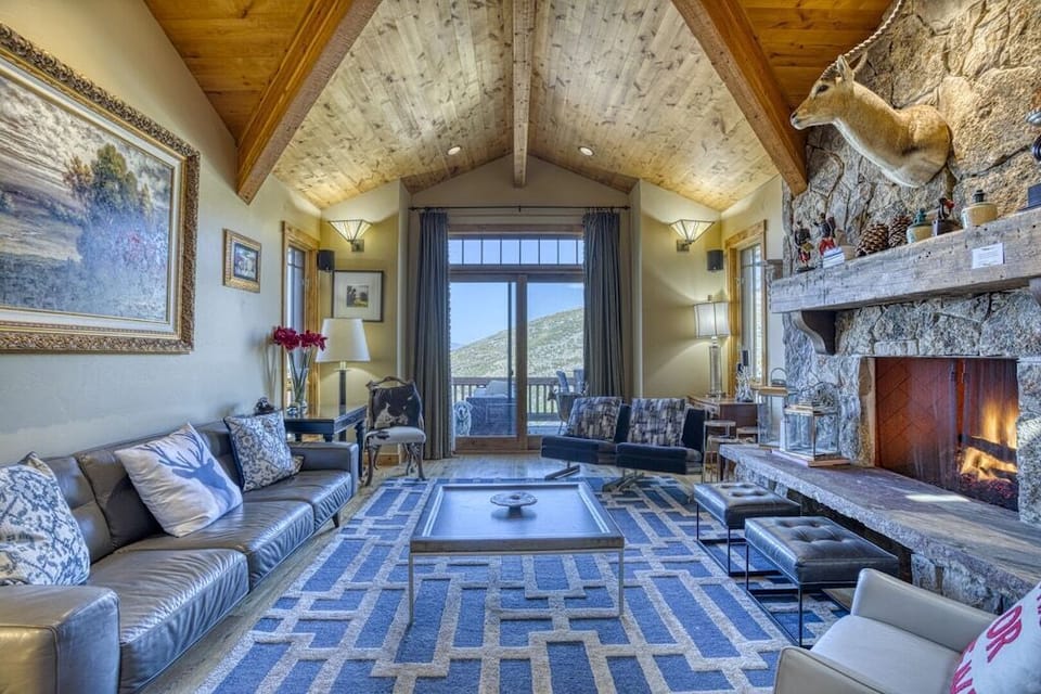 Cozy Great Room with Stone Fireplace & Mountain Views