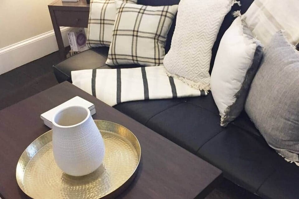 the living room at the top floor with an adjacent full bathroom