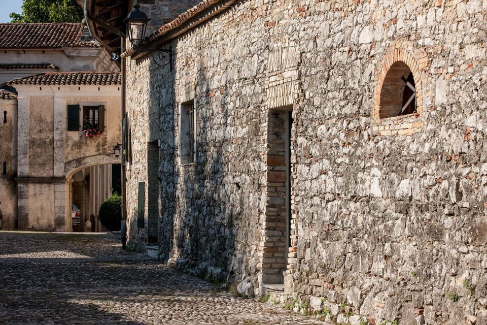 Castle complex houses on cobbled road side
