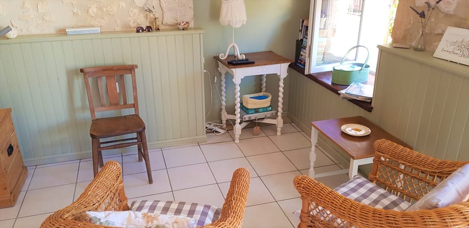 The sitting area - the TV is on the wall above the table. 