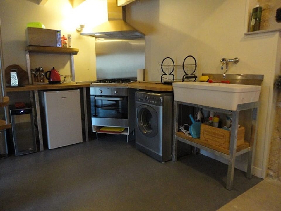 Despite being small the kitchen is well equipped and even includes a wine fridge