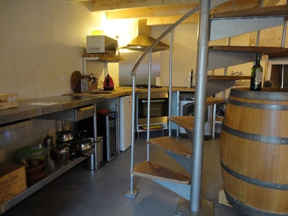 The spiral staircase leads to the gallery bedroom (and shower room)