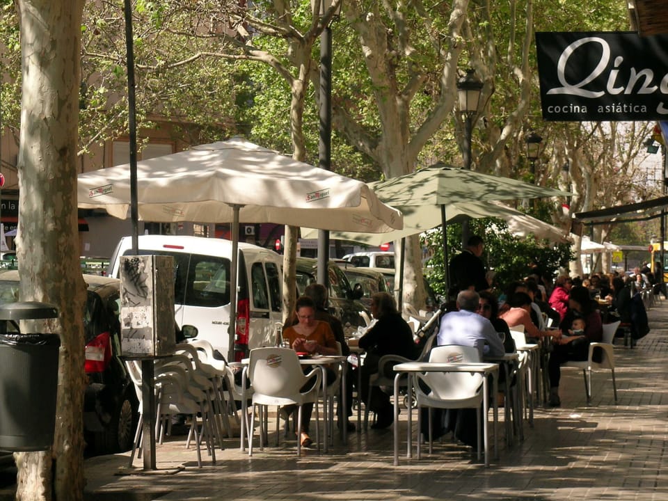 Civilised cafe society Bars, restaurants encircling art deco Mercado Abastos. 