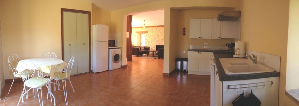 The open plan kitchen with breakfast table has all the mod cons