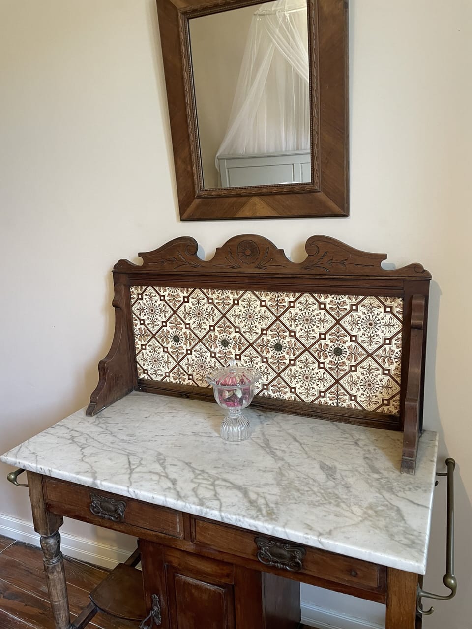 The antique washstand serves as a dressing table