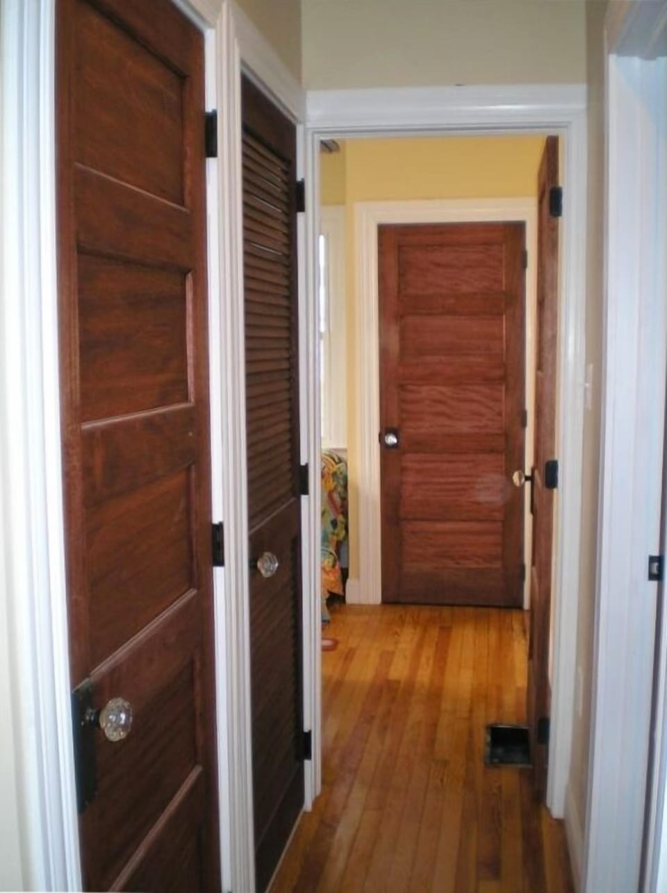 hallway into back bedroom with twin beds