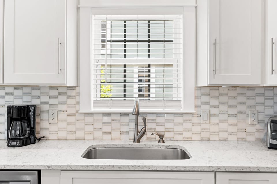Beautifully updated kitchen with loads of counter space and plenty of dishes, glassware, pots, pans, utensils for a large group.