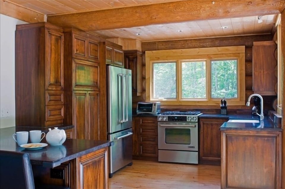 Kitchen all stainless steel appliances, gas stove, convection oven.  Gourmet!