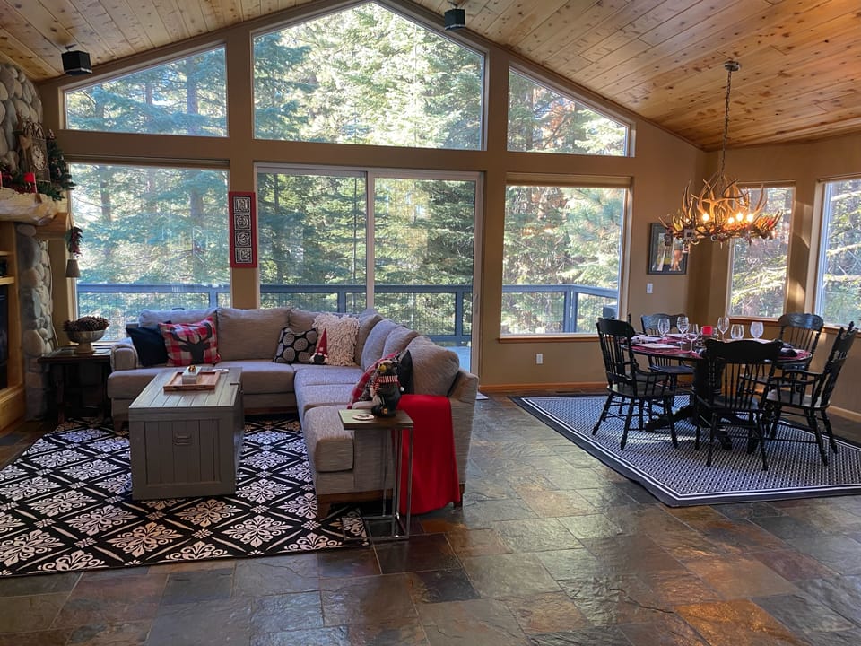 Bright family room with  forest views
