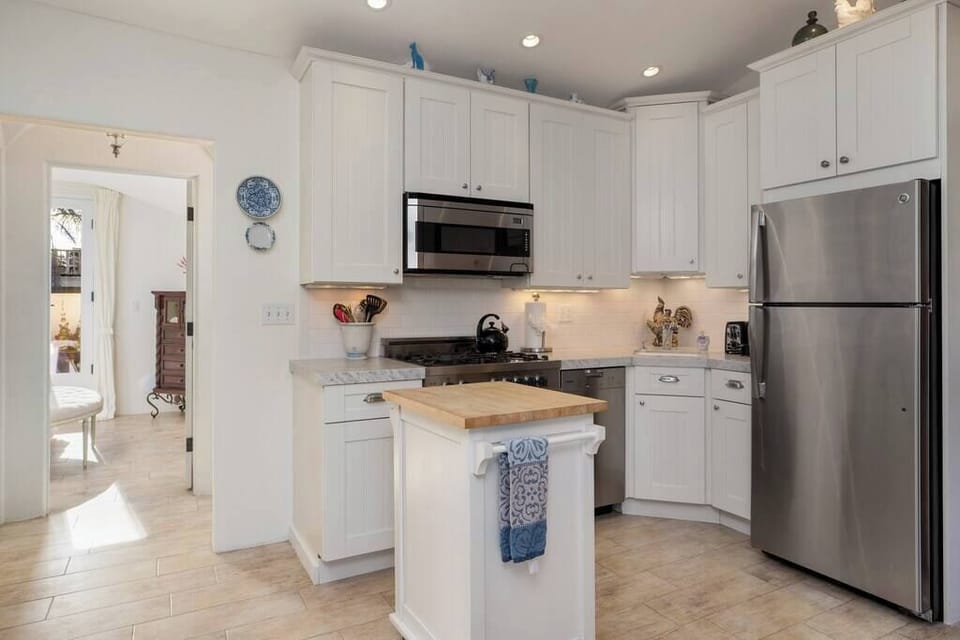 The kitchen features culinary essentials and thoughtful, high-end touches.