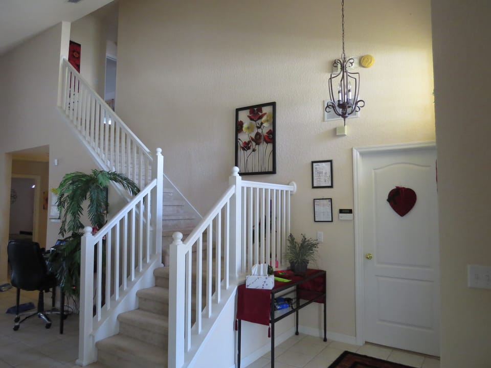 Inside entrance with view of stairs to second floor.