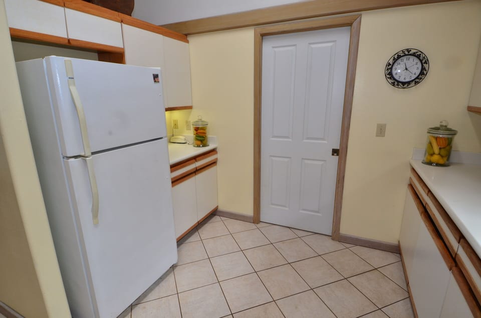 Kitchen with separate laundry room.
