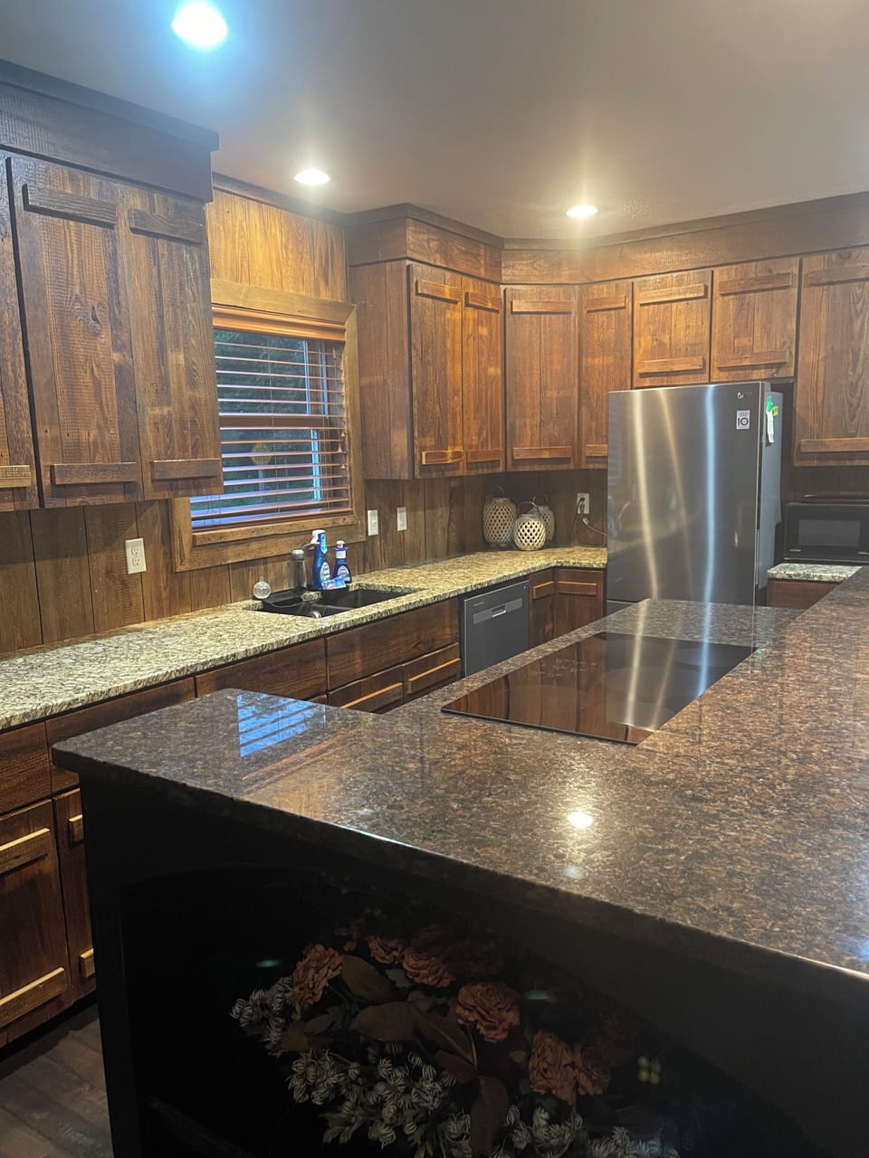 Granite countertops round out the new appliances and well stocked kitchen. 
