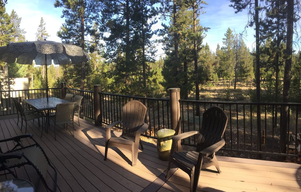 Large deck wraps around 3 sides of the home
