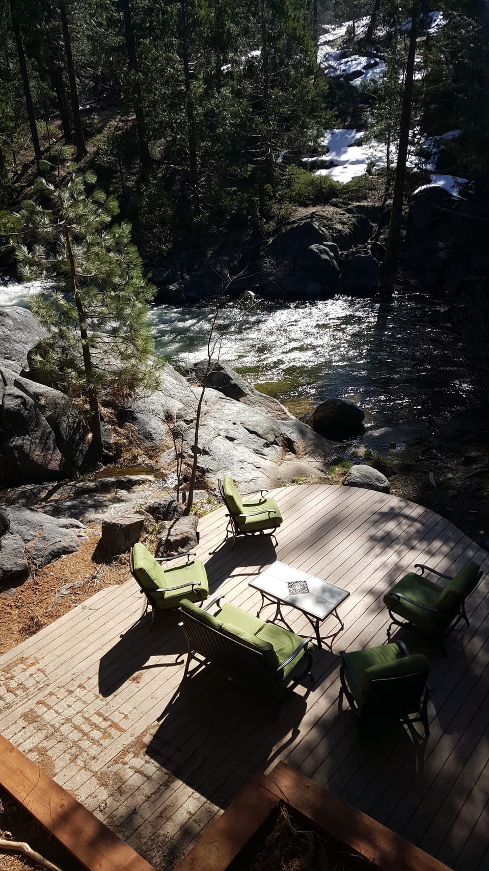 River level deck with comfy cushioned furniture