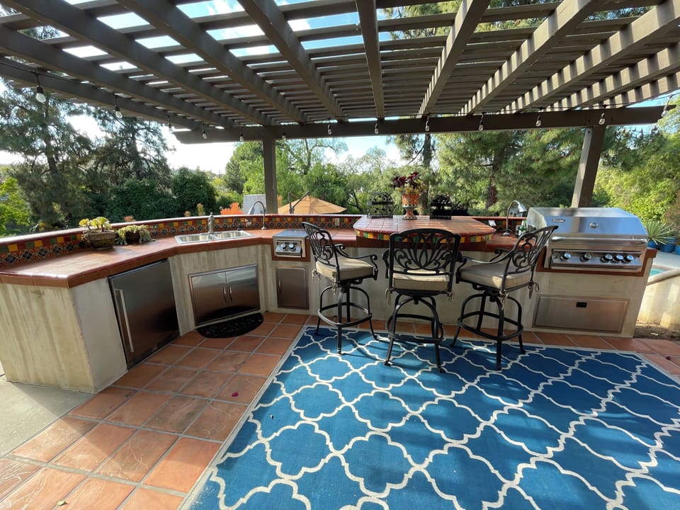Full outdoor kitchen with gas grill