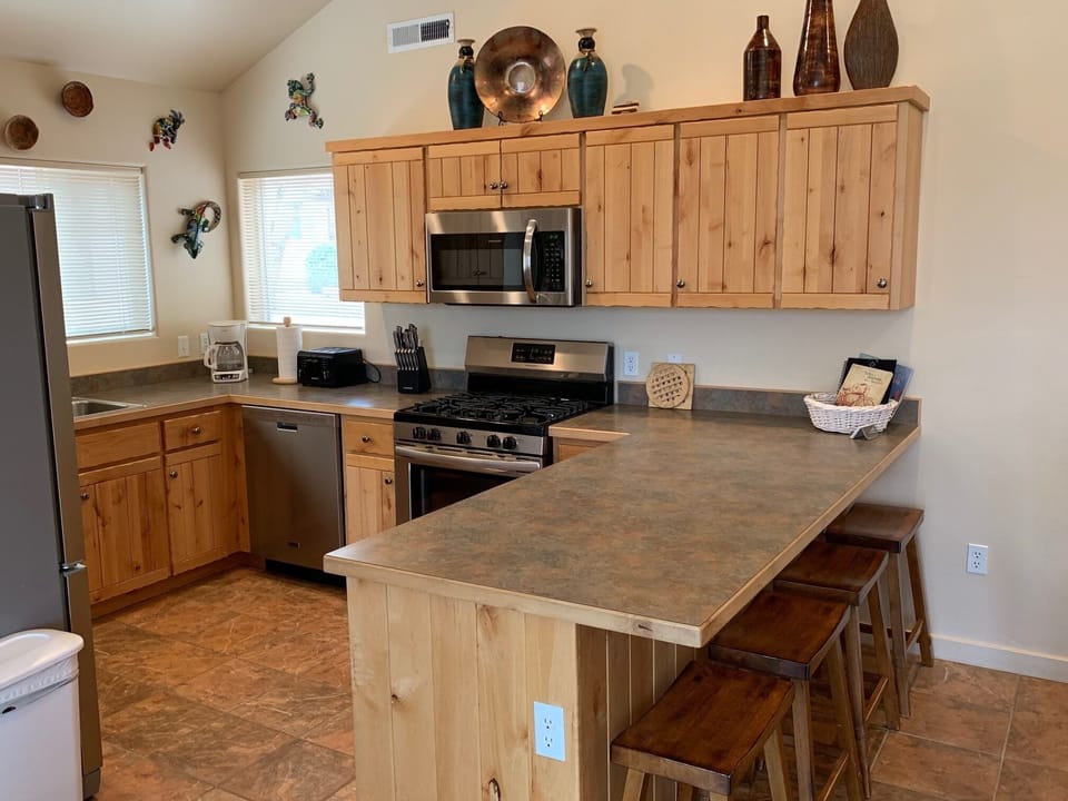 Fully equipped kitchen - place settings, cookware, silverware, baking dishes