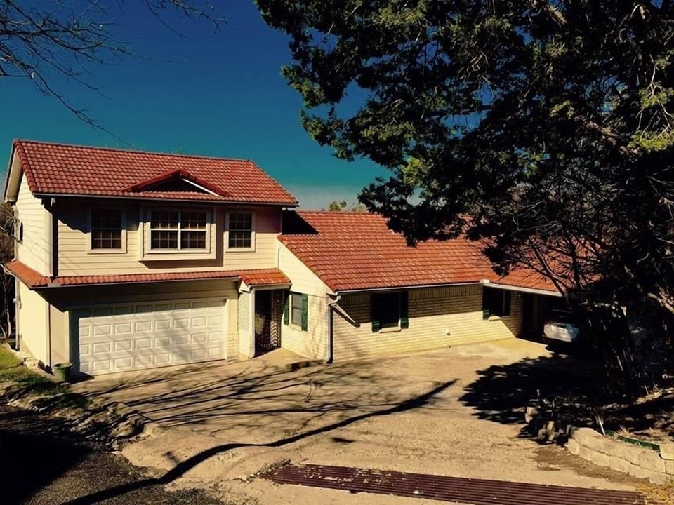 Front of Lake-House with circular Driveway & Carport 