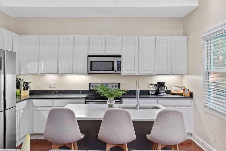 Fully stocked kitchen; dishes, glassware, cookware, baking trays, blender, etc