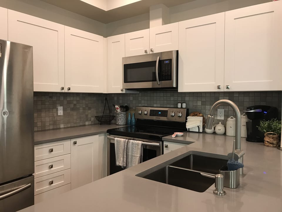 Bright, clean, well stocked kitchen.