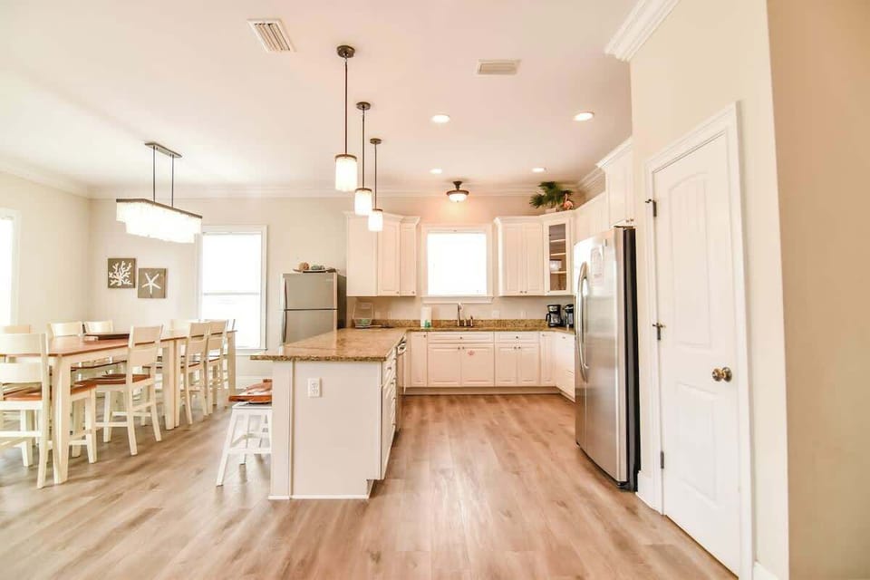 Seamless Flow Into the Kitchen Area from the Living & Dining Areas