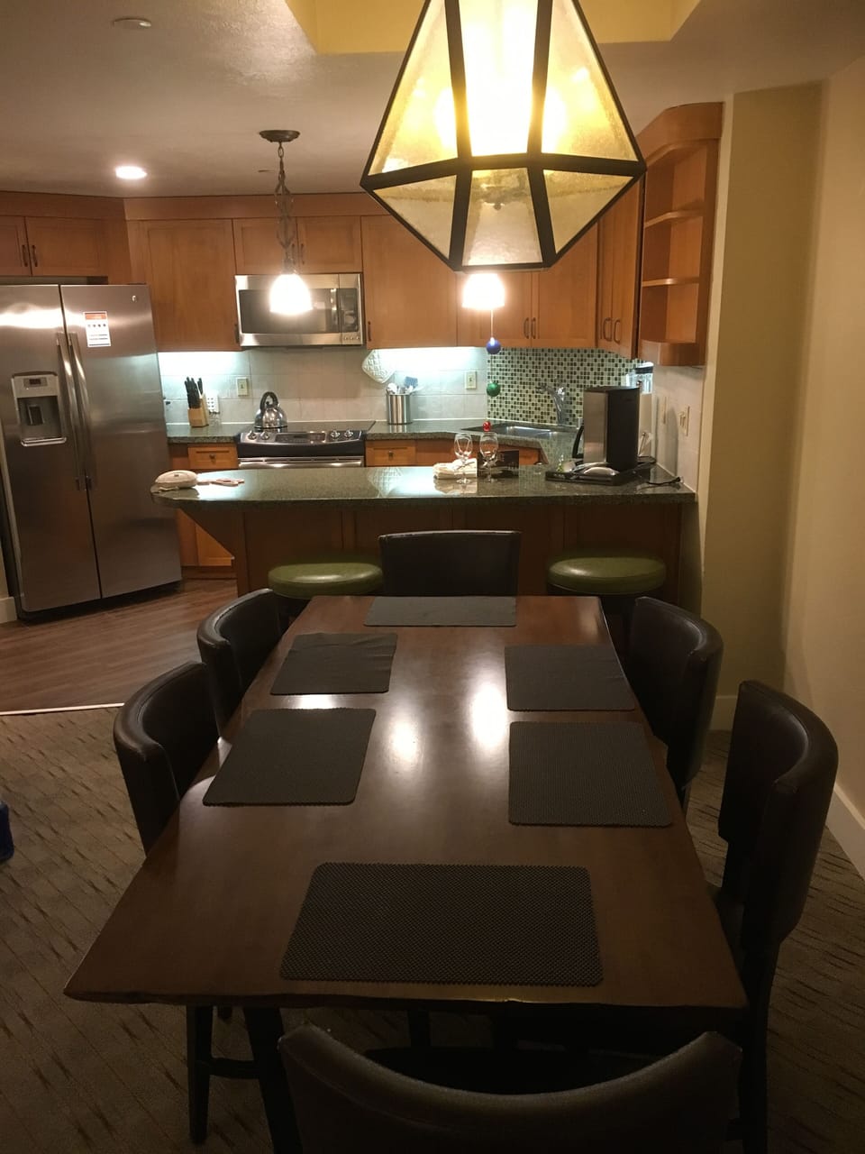 Dining table / area with kitchen area in the back