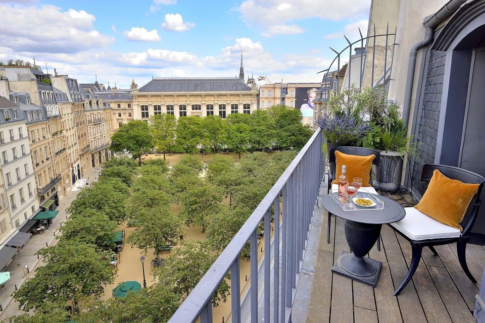 Enjoy your private balcony with a beautiful view of Place Dauphine!