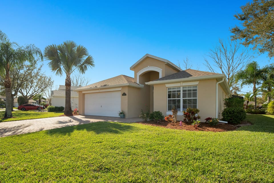 House front with House number plaque to right of garage