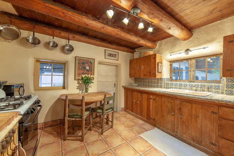 Mexican tile in the kitchen and a cozy spot to have breakfast. 

